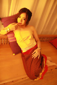 Young woman sitting at home