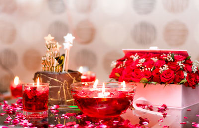 Close-up of red roses on table