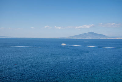 Scenic view of sea against blue sky