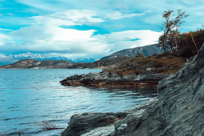 Scenic view of mountains against cloudy sky