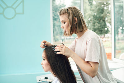 High school girls students comb their hair. anime style