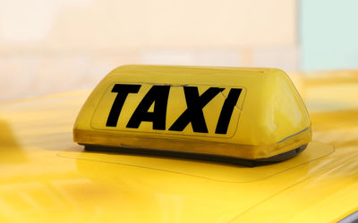 Close-up of yellow sign on table