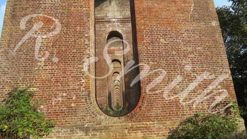 Close-up of text on brick wall