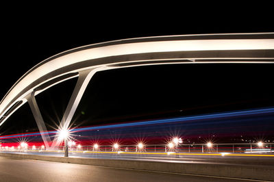 High angle view of light trails on road at night