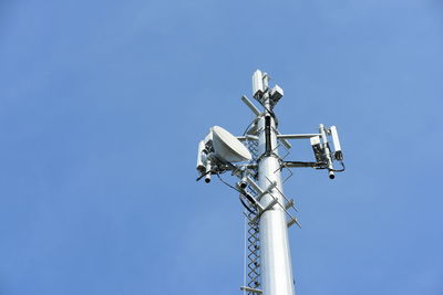 Low angle view of floodlight against clear blue sky