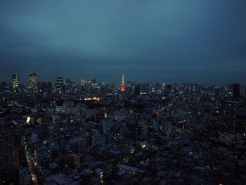 Aerial view of city lit up at night