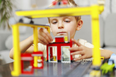 Close-up of boy playing with toy