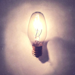 Close-up of illuminated light bulb