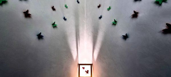 High angle view of illuminated lighting equipment on wall