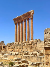 Old ruins of temple against clear sky