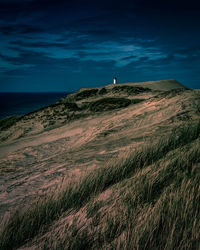 Scenic view of lighthouse and sea against sky