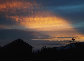 High section of built structure against cloudy sky
