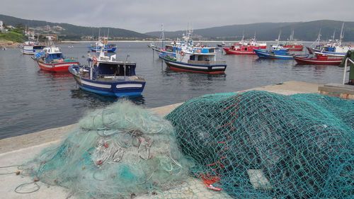 Fishing boats moored at harbor