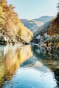 Spectacular autumn landscape in montenegro. tara river has turquoise colors and water reflections. 