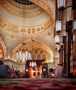 People in illuminated building