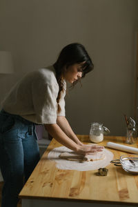 Young woman making christmas cookies