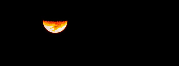 Close-up of moon against clear sky at night