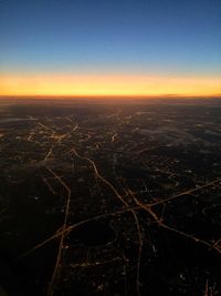 Aerial view of city during sunset