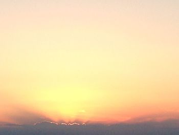 Scenic view of silhouette mountain against romantic sky at sunset