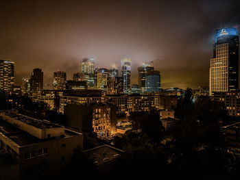 Illuminated buildings in city at night