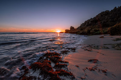 Scenic view of sea against sky during sunset