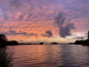 Scenic view of lake against sky during sunset