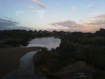 Scenic view of lake against sky during sunset