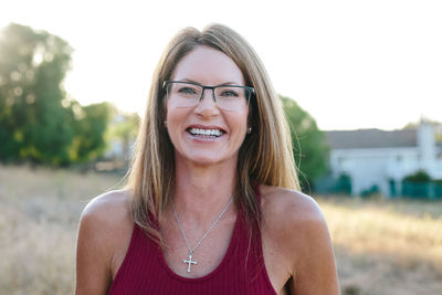 Portrait of a pretty woman wearing her husband's eyeglasses