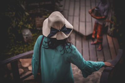 Woman moving down on staircase in park