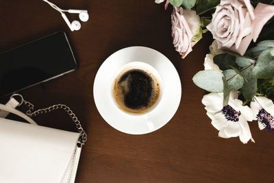 High angle view of coffee served on table