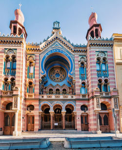 Low angle view of historical building against blue sky