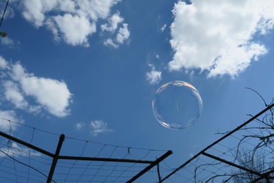 Low angle view of bubbles against sky