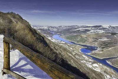 Scenic view of snowcapped mountains against sky