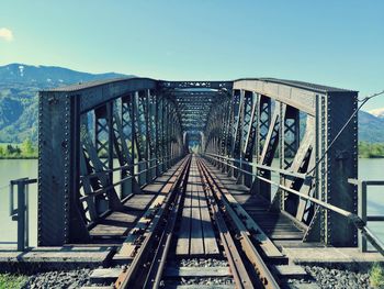 Railway bridge against clear blue sky