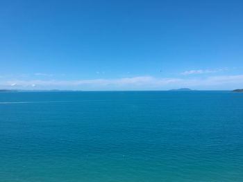 Scenic view of sea against blue sky