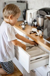 Boy standing at home