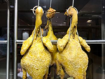 Chicken meat hanging in restaurant