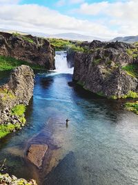 Scenic view of water flowing through rocks