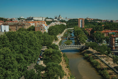 Landscape with the royal palace, almudena cathedral and manzanares river in madrid, spain.