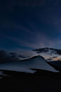 Scenic view of snowcapped mountains against sky during sunrise