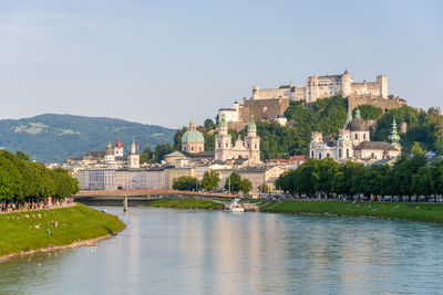 The salzburg skyline with hohensalzburg fortress and salzach river in summer, austria.