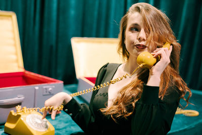 Young woman drinking coffee at home