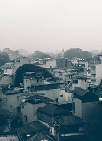 High angle view of buildings in city against clear sky