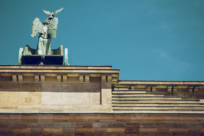 Low angle view of built structure against blue sky