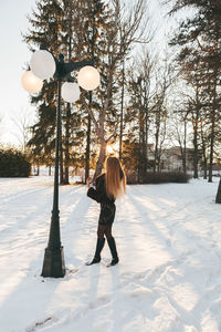 Full length of woman standing on road