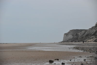 Scenic view of beach against clear sky