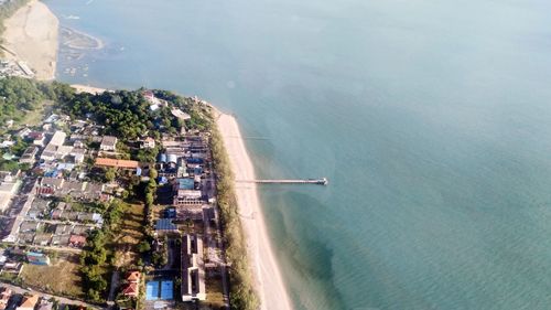 High angle view of buildings by sea