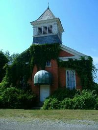 Low angle view of building against blue sky