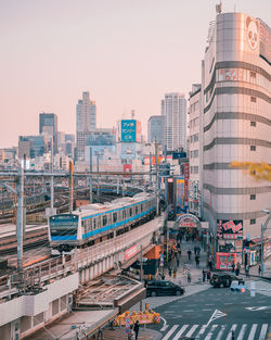 High angle view of city buildings against clear sky