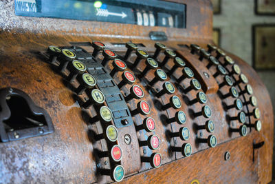 Close-up of old machine part on table